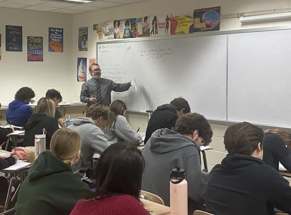 Ted Arison, math teacher, teaches a lesson to his AP statistics class during fourth period. 