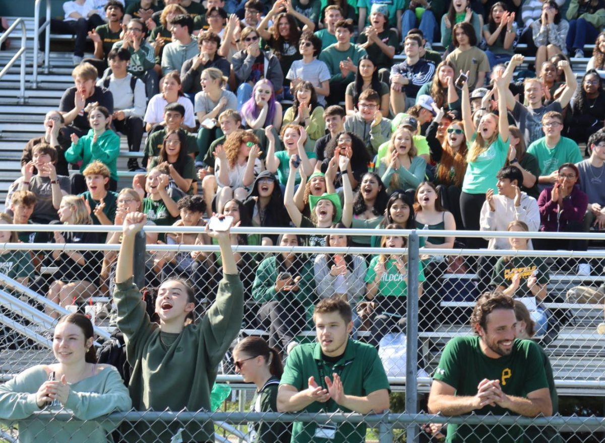Students and staff cheer on classmates at the annual pep rally.