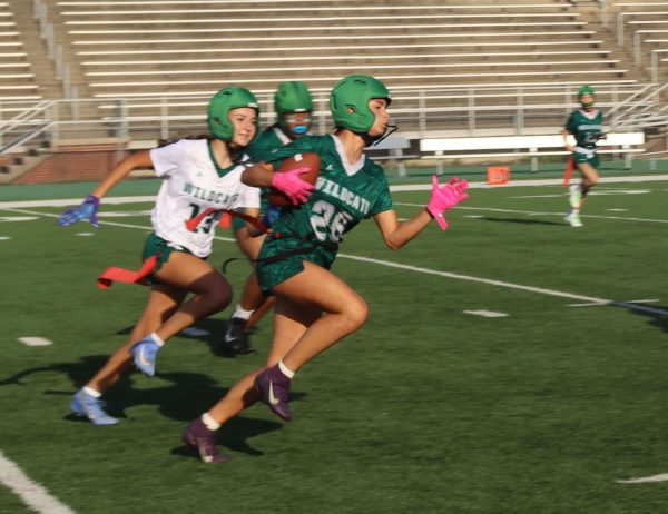 Sophomore Sophia Heyl attempts to catch freshman Victoria Mota at Green and White night.