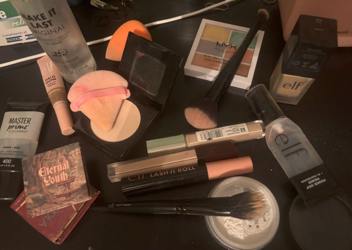 A varied assortment of makeup products, including skin prep items, highlight the artistry behind cosmetic application.