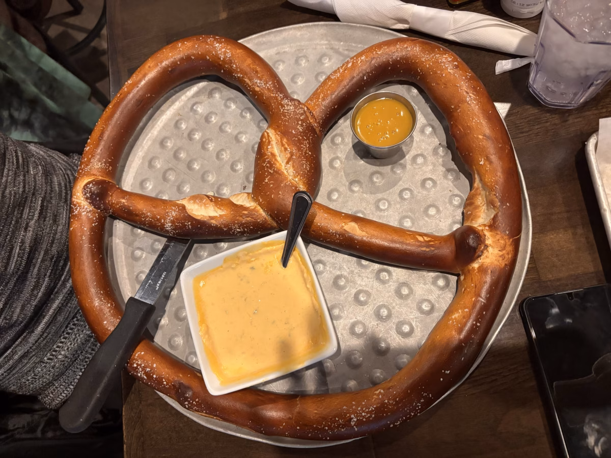 The salty, soft, and buttery pretzel pairs divinely with the spicy cheese sauce, making customers want to come back for more.