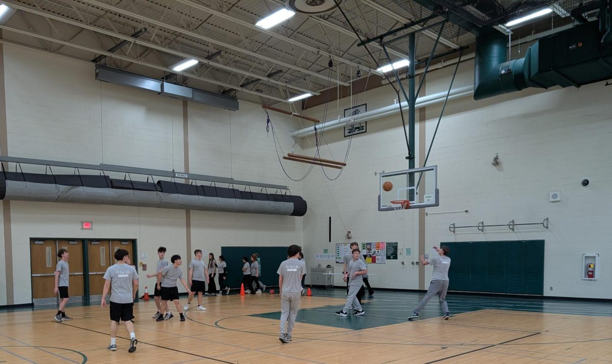 Freshmen students play basketball during a fitness club day, part of a PE elective class they can now choose for second semester.