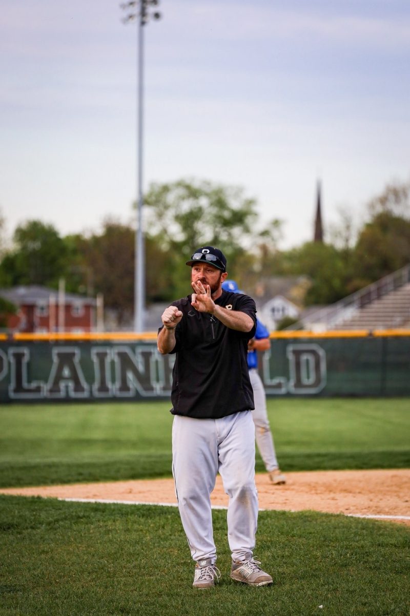 Robert Keane, varisty boys baseball coach, leads the team to an
outstanding victory of 9-2 against Joilet Central on April 27.
