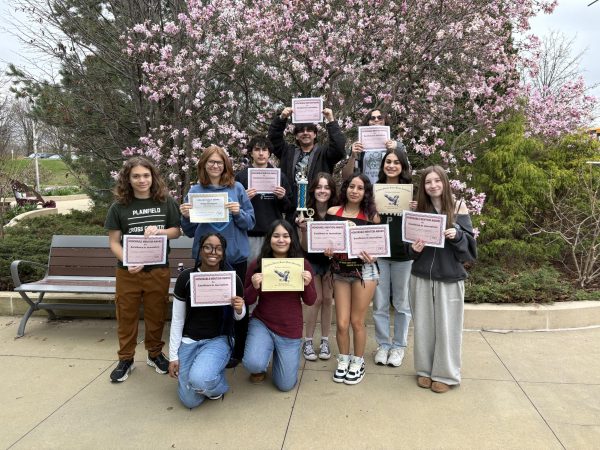 Journalism class members display multiple awards at the
NISPA conference on April 10.